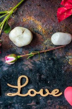 Letters LOVE on rustic background Stock Photos