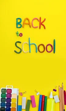 Letters made of multi-colored plasticine back to school and watercolor paints Stock Photos