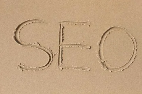The letters s e o drawn in the sand Stock Photos
