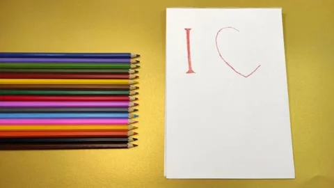 Letters written on a sheet of paper, folding into the inscription I love you. Stock-Footage 146223793