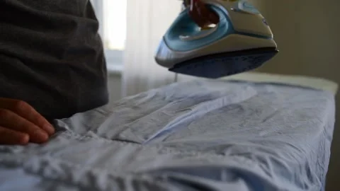 Letting off hot steam from iron Stock Footage 138978840