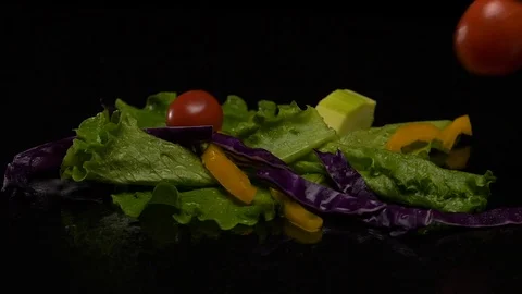Lettuce and vegetables on black background Stock Footage 80598317