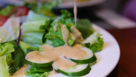 Lettuce cucumber salad process of making homemade summer fresh vegetable salad Stock Footage 314504639