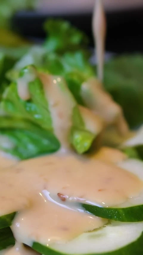 Lettuce cucumber salad process of making homemade summer fresh vegetable salad Stock Footage 314623105