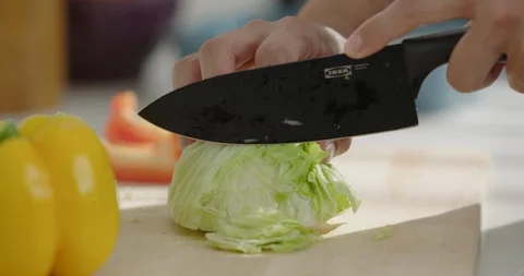 Lettuce cutting hands, close-up Stock Footage 100944547
