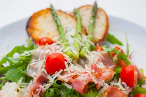 Lettuce  with fried pancetta Stock Photos