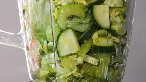 Lettuce, green spinach, celery and cucumber are stirred in a mixer to make a 스톡 동영상 178484637