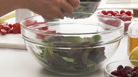 Lettuce salad with cherry tomatoes step by step recipe, close up video Video stock 144486027