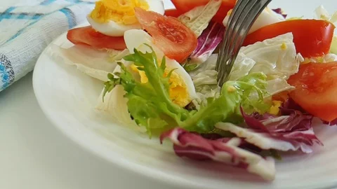 Lettuce tomato egg fork Stock Footage 87659520