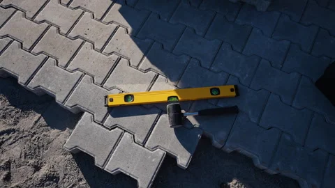 Level and Mallet on Paving Slabs Stock Footage 297788785