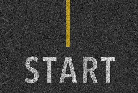 Level asphalted road with a dividing stripes. The texture of the tarmac. Stock Photos