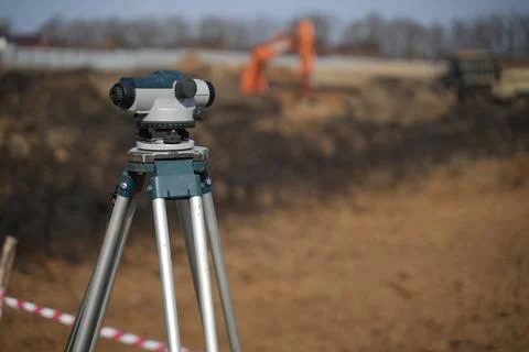 Level at the construction of the foundation on the background of an exvator Stock Photos