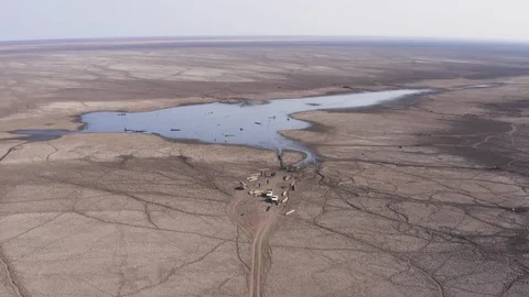 Level of devastation of a drying up lake due to drought and climate change Stock Footage 118265662