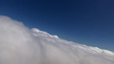 Level flight above fluffy cloud layer Stock Footage 59414558