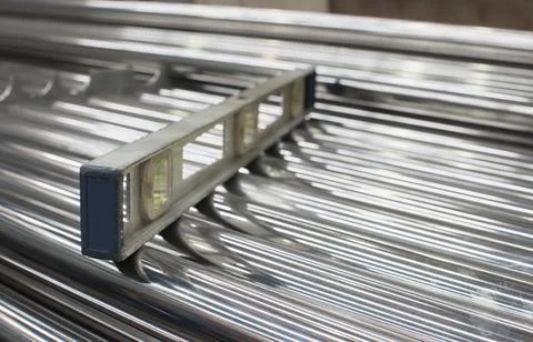 Level on a stack of steel tubes Stock Photos