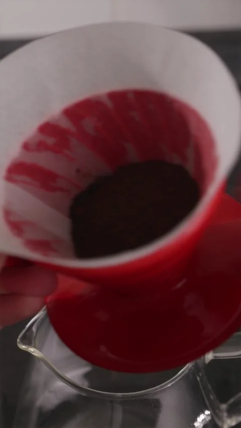Leveling coffee grounds in V60 for even extraction Stock Footage 332720150