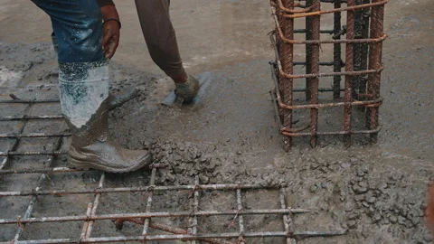 Leveling concrete for reinforced foundation close-up Stock Footage 305886567
