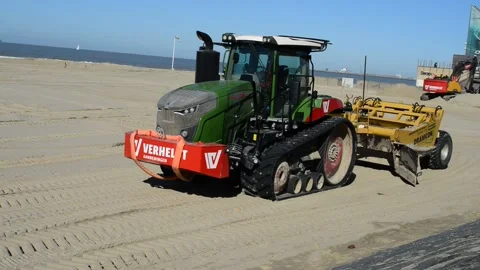 Leveling flat Blankenberge beach before Easter holiday starts Stock Footage 172093159