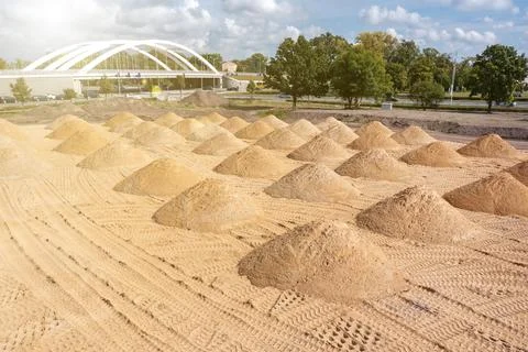 Leveling the ground. empty construction site of a residential area with a pil Stock Photos