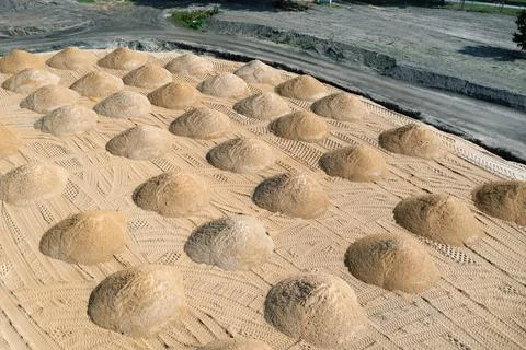 Leveling the ground. empty construction site of a residential area with a pil Stock Photos