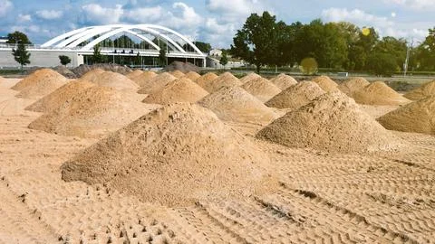 Leveling the ground. empty construction site of a residential area with a pil Stock Photos