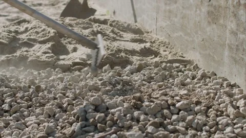 Leveling out rock with a rake. Stock-Footage 255857014