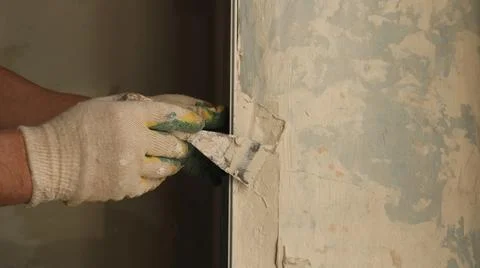 Leveling the slope angle by hand with a trowel and copy space to the right Stock Photos
