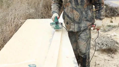 Leveling the surface of the Board Stock Footage 97858793