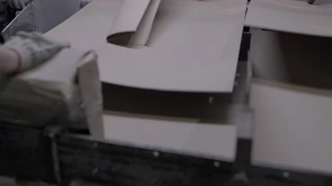 Leveling surface of cardboard sheets on machine in plant Stock Footage 295152279