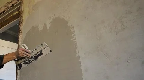 Leveling the wall with a layer of plaster next to the doorway Stock Photos