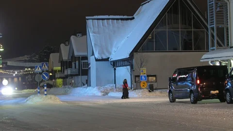 Levi ski resort with small and cozy hotels, relaxed tourists and going cars in Stock-Footage 123088423