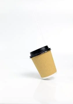 Levitating Isolated Brown Beige Paper Drinks Mug, Cup with Black Lid, Straw On Stock Photos