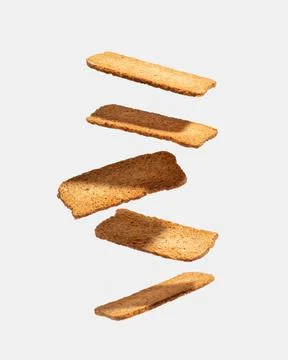 Levitating loaves on a gray background. Isolate. Stock Photos