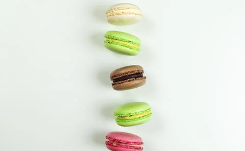 Levitating macaroon pastries on gray background front view Stock Photos