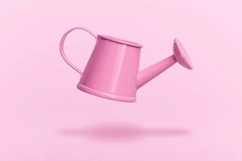 Levitating watering can Stock Photos