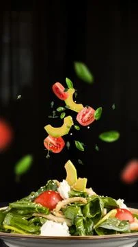 Levitation salad with avocado and tomatoes Stock Photos