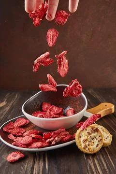 Levitation, Strawberry chips fall into ceramic plate with wooden handle and Photos