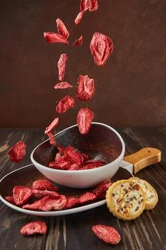 Levitation, Strawberry chips fall into ceramic plate with wooden handle and Photos