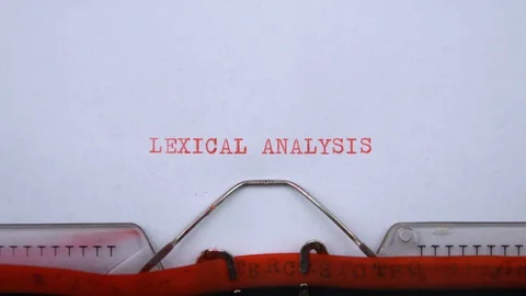 Lexical analysis - phrase printed on an old typewriter in red letters, close up. 動画素材 129535841