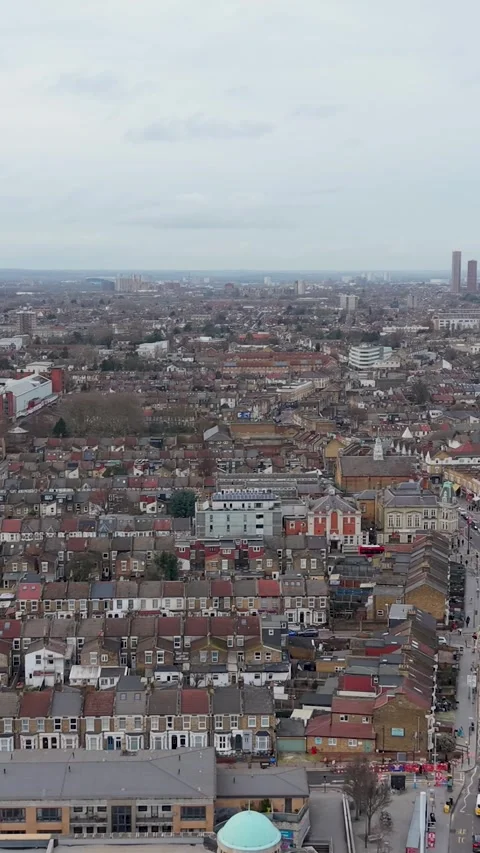 Leyton London vertical format drone pan north from Leyton station to town hall Stock Footage 328949321