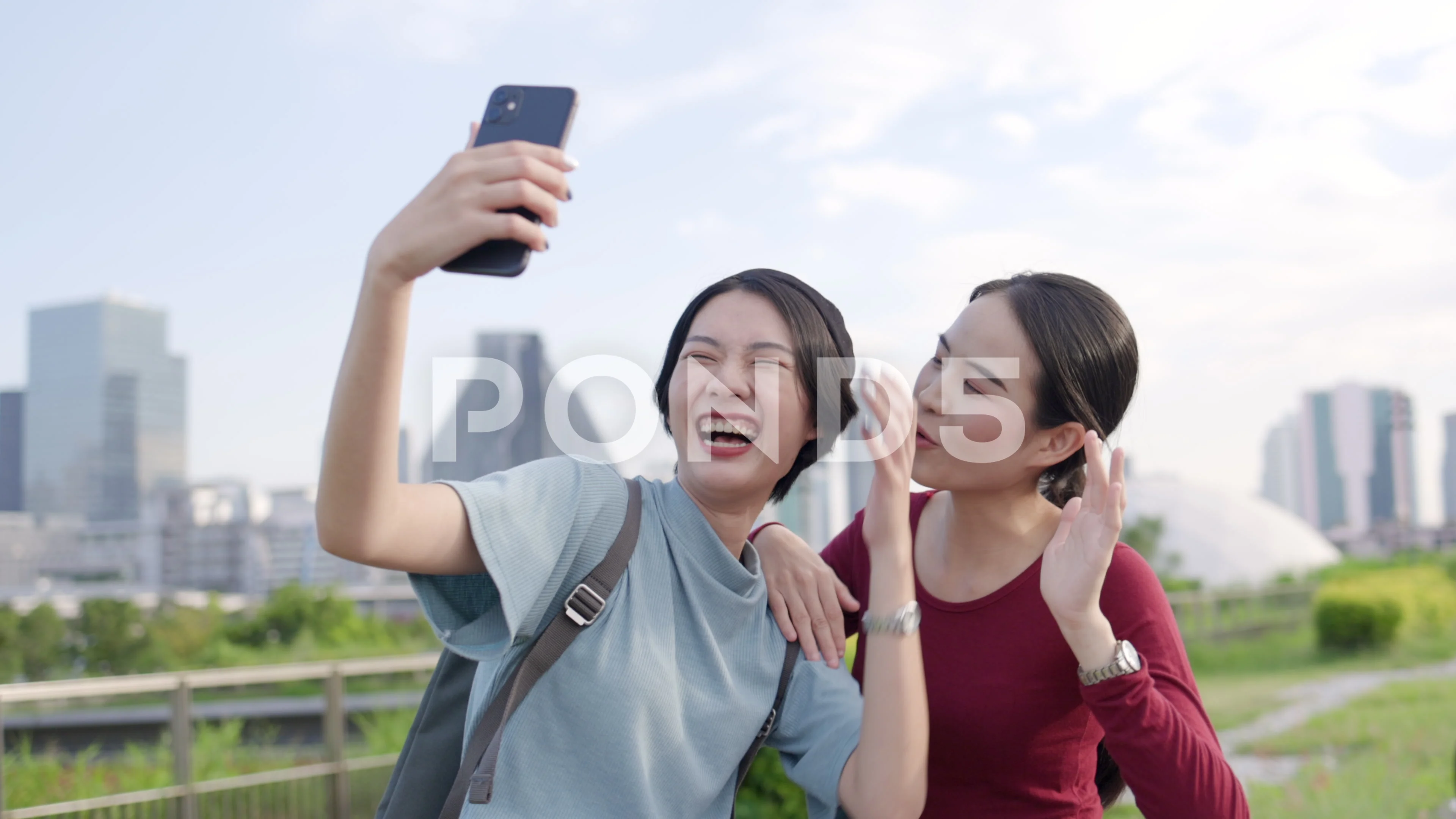 LGBT Asian Lesbian Couple Selfie and Family Video Call Using a smartphone