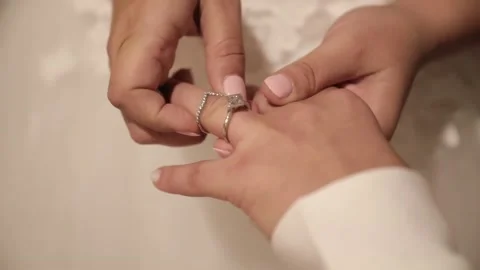 The LGBT Bride puts the wedding ring on the finger of the Groom Stock Footage 173074677