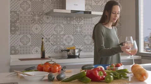 LGBT Couple Toasting with Wine While Cooking 库存影片 334318355