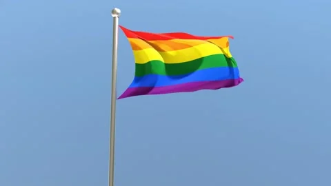 LGBT flag on flagpole. Rainbow flag fluttering in the wind Video stock 168476790