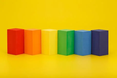 LGBT flag made of rectangular geometric figures on yellow background. Fotos de archivo