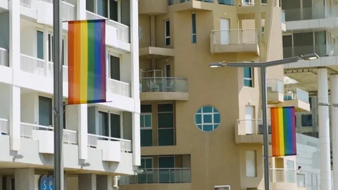 LGBT flags showing on street posts in Tel Aviv, Israel during Gay Parade Stock Footage 110657402