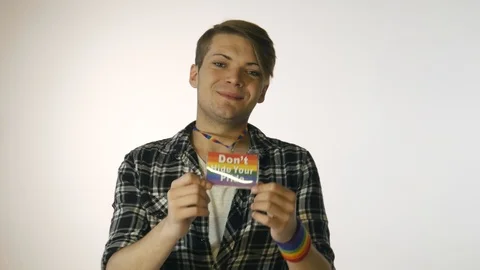 LGBT Guy with don't hide your pride card Stock Footage 111183816