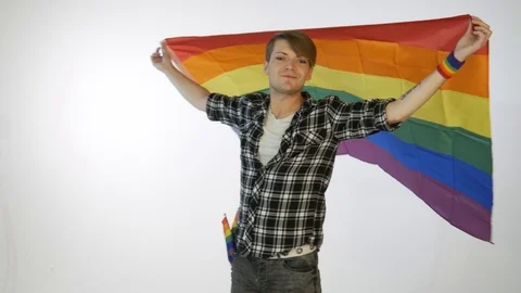 LGBT Guy twirling with flag Stock Footage 111189976