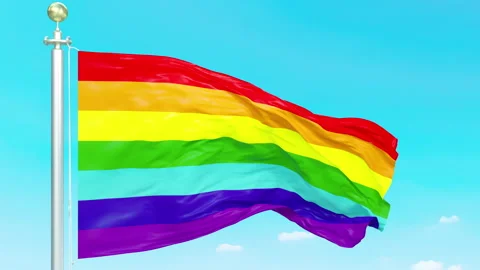 LGBT Pride Rainbow Flag Waving in Blue Sky Vidéo 334319924