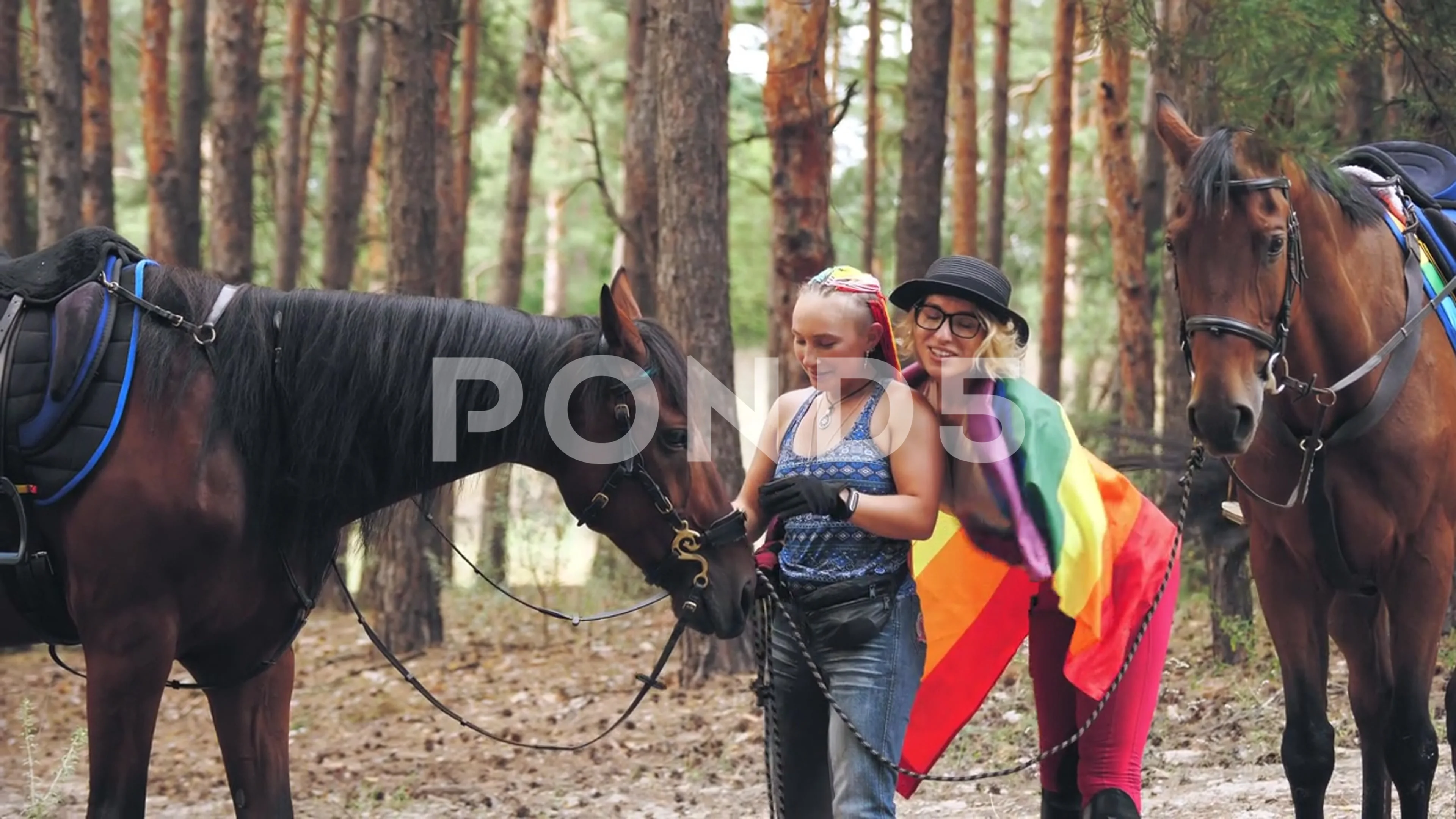 lgbt. rainbow flag. same-sex love. young lesbian same-sex couple is engaged  in